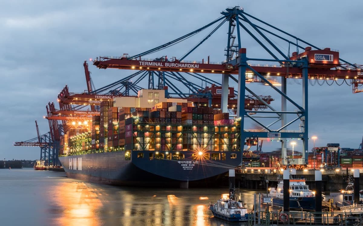 A container ship being loaded at the terminal